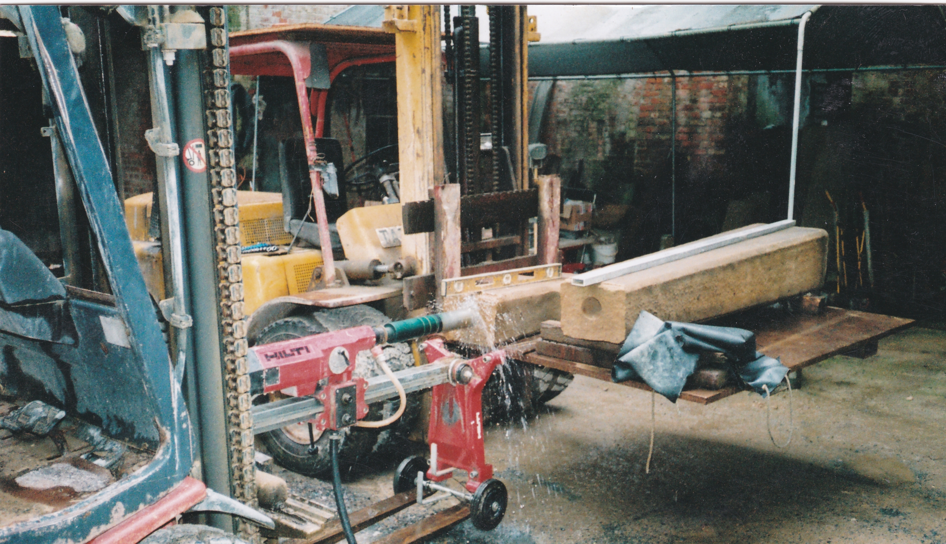 War Memorial sat on a piece of machinery being fixed with a drill 